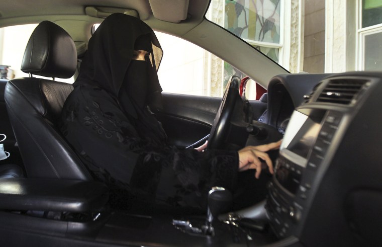 A woman drives a car in Saudi Arabia