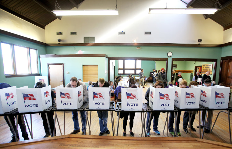Image: Voters cast their ballots at the Wil-Mar Neighborhood Center on the Near East Side of Madison, Wisconsin