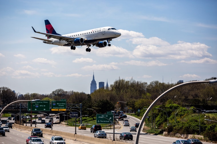 Image: A Delta plane prepares for landing at LaGuardia Airport in New York