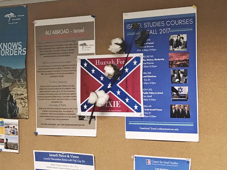 Image: A confederate flag poster with a cotton plant is seen hanging at American University.