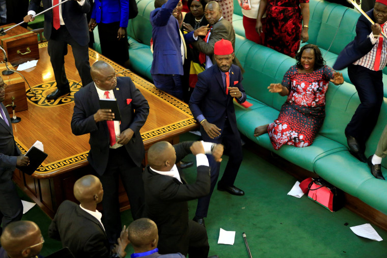 Image: Ugandan opposition lawmakers fight with plain-clothes security in parliament in Kampala