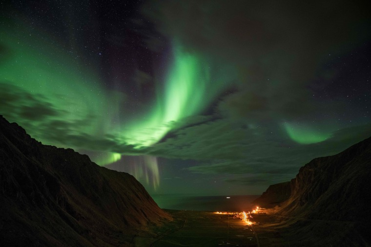 Image: Northern lights are visible on Unstad's bay in the arctic circle