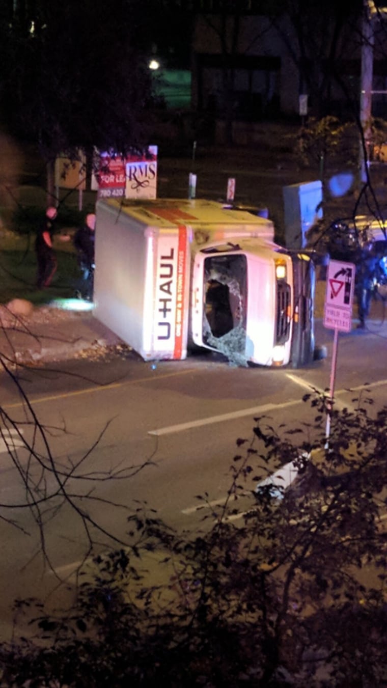Image: The U-Haul flipped during a police chase in downtown Edmonton, Alberta, according to Canadian police.