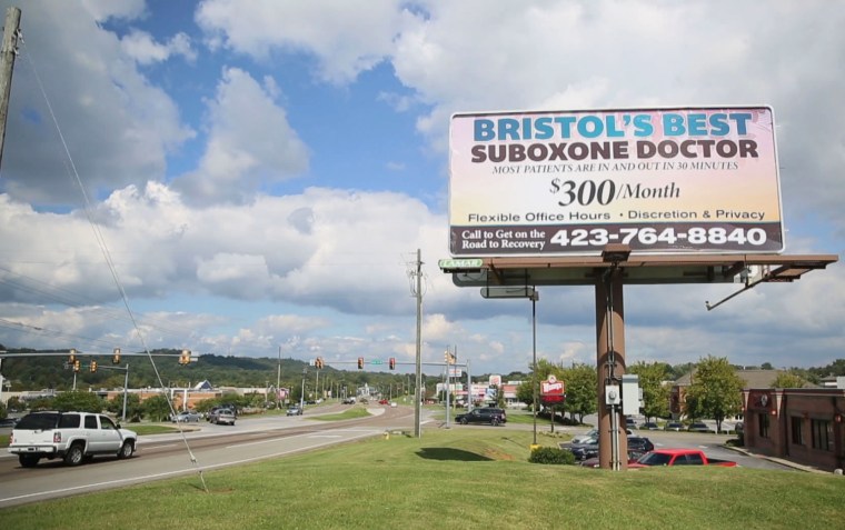 Image: A billboard advertises a clinic that distributes Suboxone