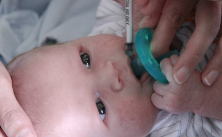 Image: A nurse administers morphine to a child born with neo-natal abstinence syndrome