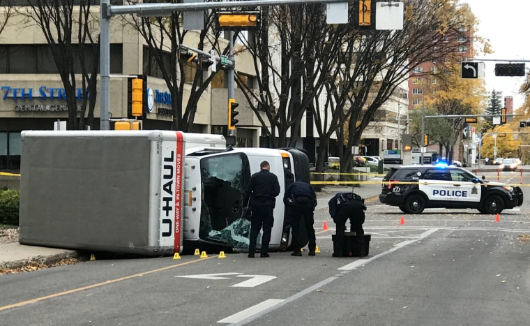 Image: Edmonton Police investigate at the scene where a man hit pedestrians then flipped the U-Haul truck in Edmonton