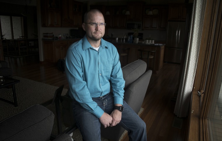 Mike Haugen in his parents' home in Forest City, Iowa.