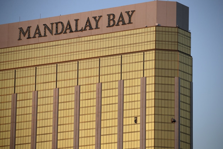 Image: Drapes billow out of broken windows at the Mandalay Bay Resort and Casino 