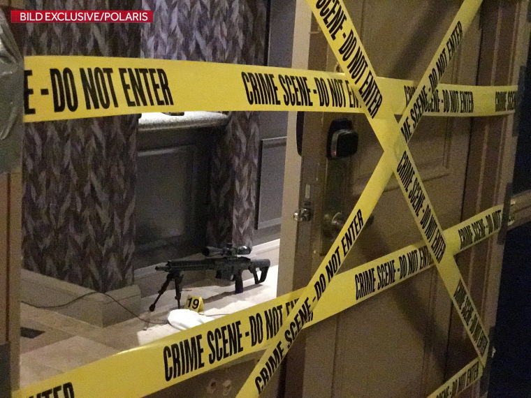 Image: Crime scene tape lines the door of gunman Stephen Paddock's suite on the 32nd floor of the Mandalay Bay Resort and Casino in Las Vegas