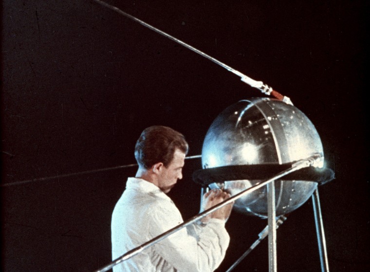 Soviet technician working on sputnik 1, 1957.
