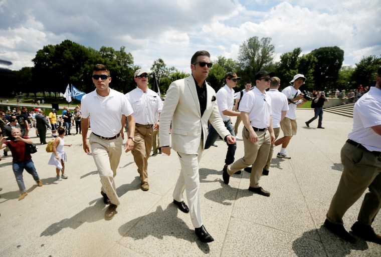 Image: Richard Spencer leaves the area in front of the Lincoln Memorial surrounded by bodyguards after self proclaimed \"White Nationalists,\" white supremacists and \"Alt-Right\" activists gathered at the memorial in Washington, on June 25, 2017.