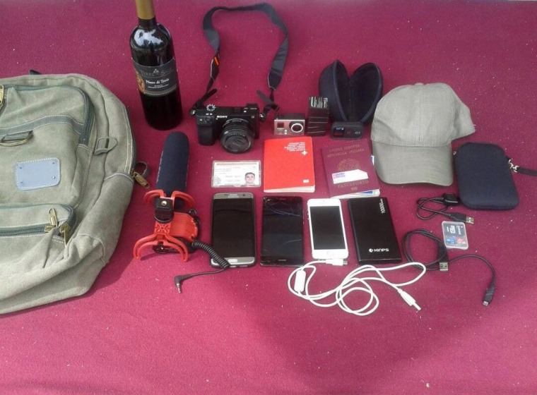 Image: Items belonging to journalists Jesus Medina, Roberto Di Mateo and Filippo Rossi, arrested at Tocoron, Venezuela are displayed on a table