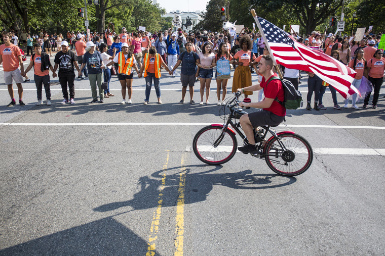 Image: Demonstrators block traffic during a rally in support of DACA