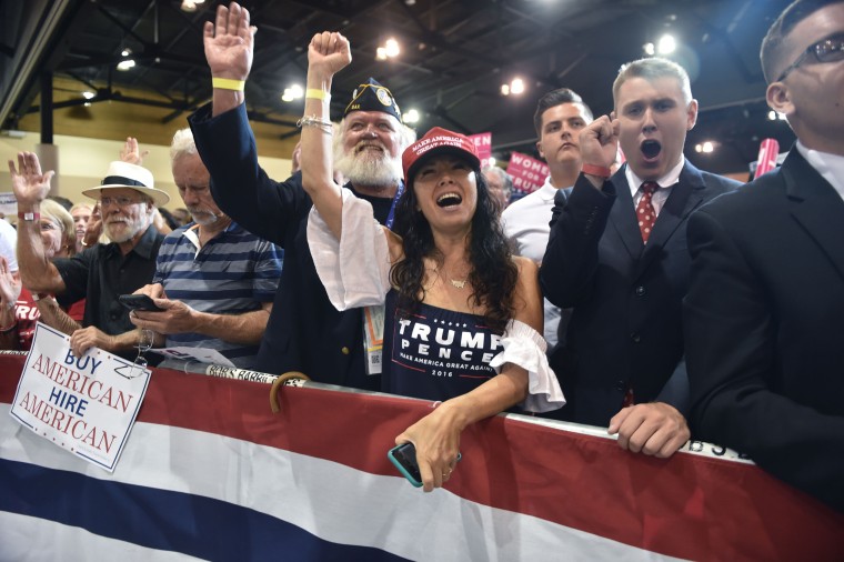 Image: Supporters cheer as President Donald Trump speaks at a rally in Phoenix