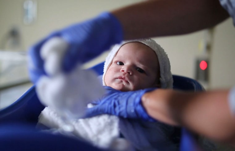 Image: An infant born with neonatal abstinence syndrome (NAS) receives a bath