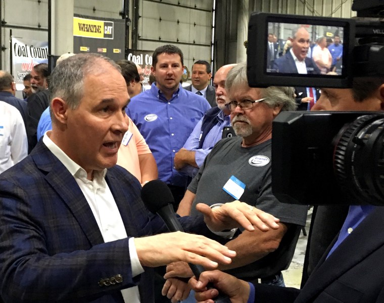 Image: EPA Administrator Scott Pruitt talks to a reporter