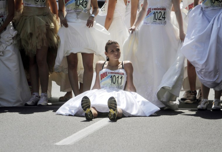 Image: A bride rests before the start of a race