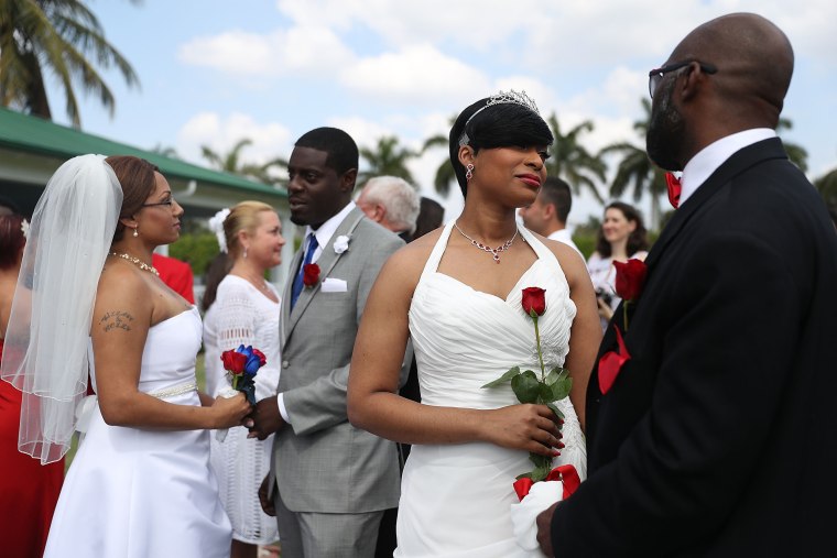Image: Couples participate in a group Valentine's day wedding ceremony
