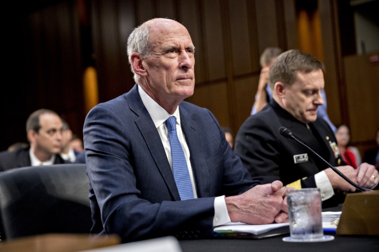 Image: Dan Coats wait for the start of a Senate Intelligence Committee hearing