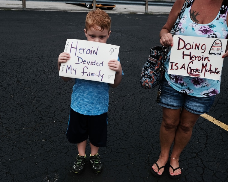 Image: Derrick Slaughter, 5, attends a march against the heroin epidemic with his grandmother