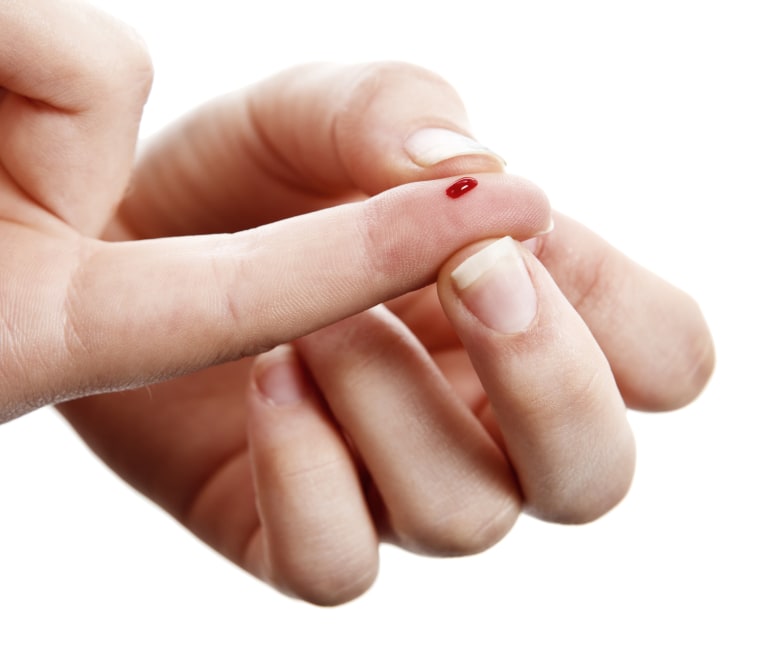 Diabetics drop of blood on finger