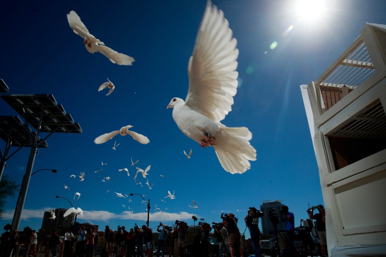 Image: Fifty-eight white doves are released in honor of the victims of the mass shooting in Las Vegas