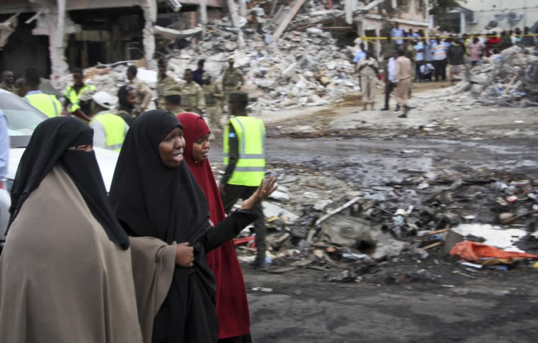 Image: Somali women react at the scene of the blast