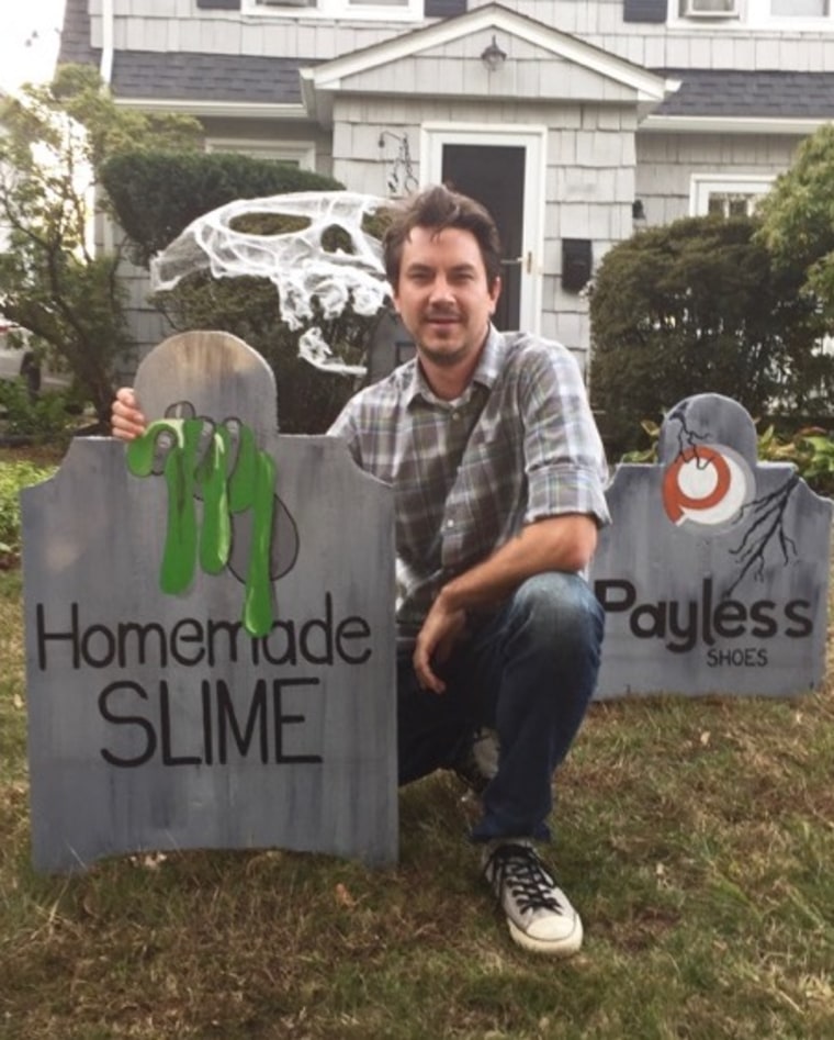 Michael Fry with his gravestone for homemade slime.