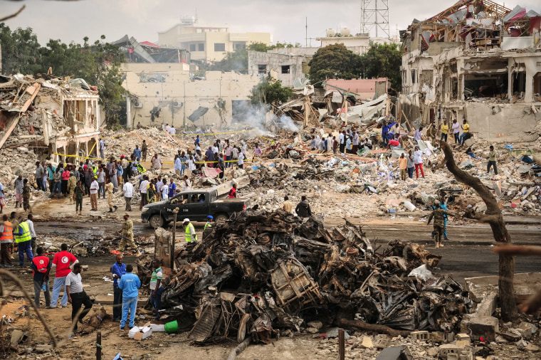 Image: A general view of the scene of the explosion of a truck bomb in the centre of Mogadishu.