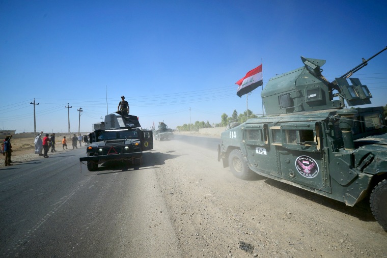 Image: Members of Iraqi federal forces gather to continue to advance in military vehicles in Kirkuk, Iraq, Oct. 16, 2017.