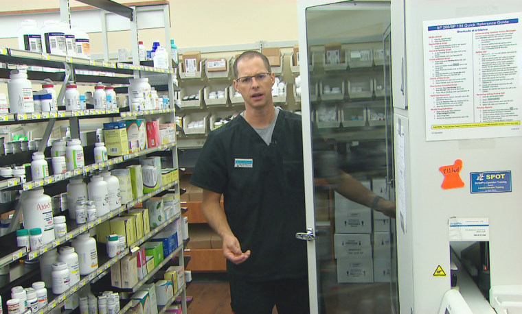Image: Pharmacist Steve Hoffart inside Magnolia Pharmacy in Magnolia, Texas