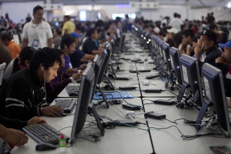 People of all ages surf the web at the Digital Village in Mexico City, Friday, July 17, 2015.