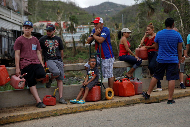 Image: Residents affected by Hurricane Maria wait in line for fuel donated by the Fuel Relief Fund in the municipality of Orocovis, outside San Juan