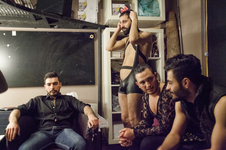 Image: Omar, second right, sits in the dressing room during the Mr. Gay Syria contest in Istanbul