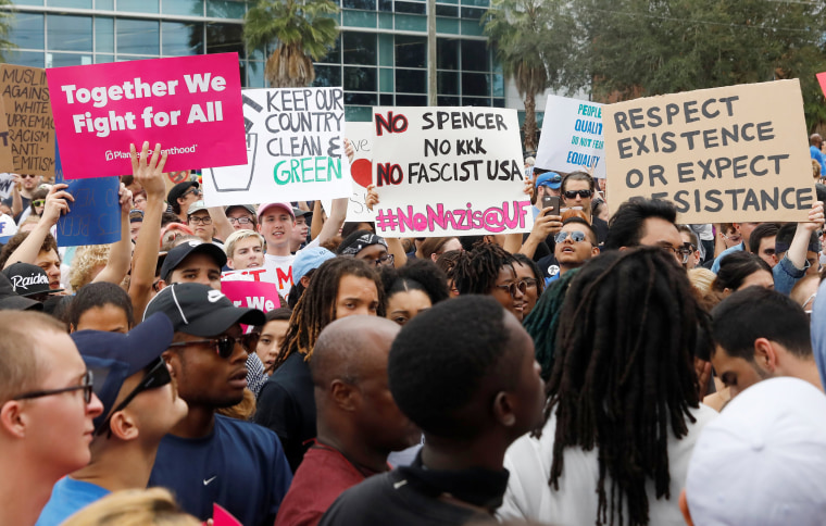 Image: Demonstrators rally before the speech by Richard Spencer