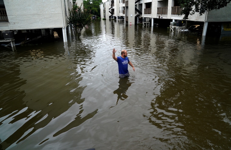 Image: A volunteer looks for people wanting to be evacuated from the Hurricane Harvey floodwaters in Dickinson, Texas, Aug. 28, 2017.