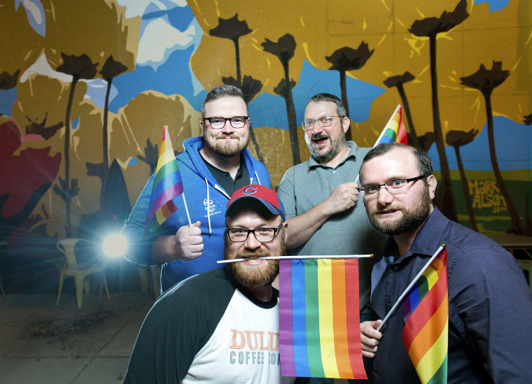 In this Monday, Oct. 16, 2017 photo, front row from left, organizers of OC Pride, Steve Mahr, Cody Bauer; back row from left, Mike Goll and David Klennert pose for a photo in Orange City, Iowa. The community, well known for its conservative values, is now hosting its first gay pride festival.