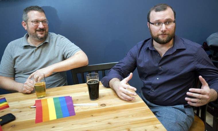 In this Monday, Oct. 16, 2017 photo, David Klennert, left, and Cody Bauer, two of the organizers of OC Pride, discuss the significance of hosting the pride festival during an interview in Orange City, Iowa. 