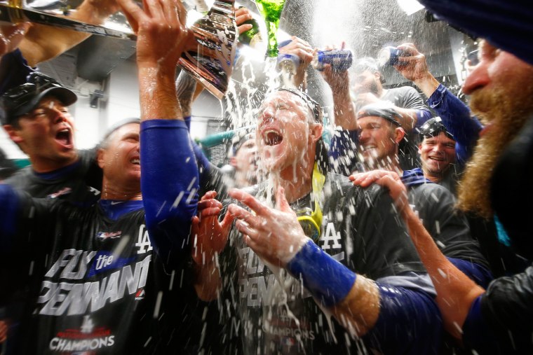 Image: Chase Utley #26 of the Los Angeles Dodgers celebrates in the clubhouse