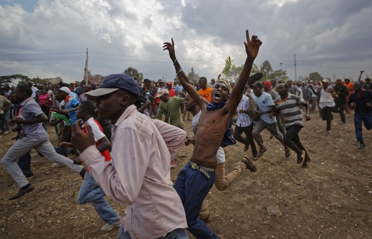 Image: Supporters of Kenyan opposition leader Raila Odinga run through the crowd