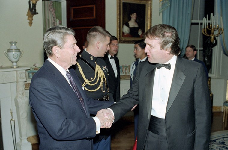 Image: Reagan shakes hands with Donald Trump in 1987