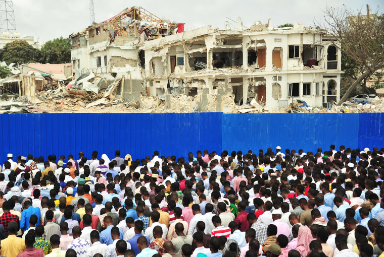 Image: Somalis pray for victims on Oct. 20, 2017 in Mogadishu on the scene of a massive truck bomb attack