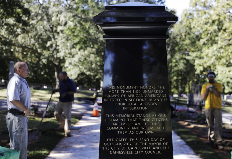 Image: An inscription decorates a monument to honor African-Americans who were buried in unmarked graves