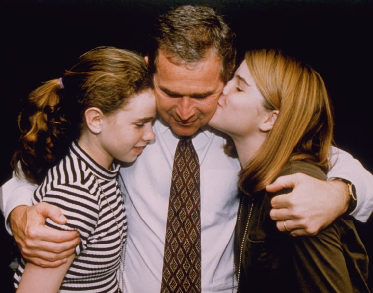 George W. Bush Hugging Daughters