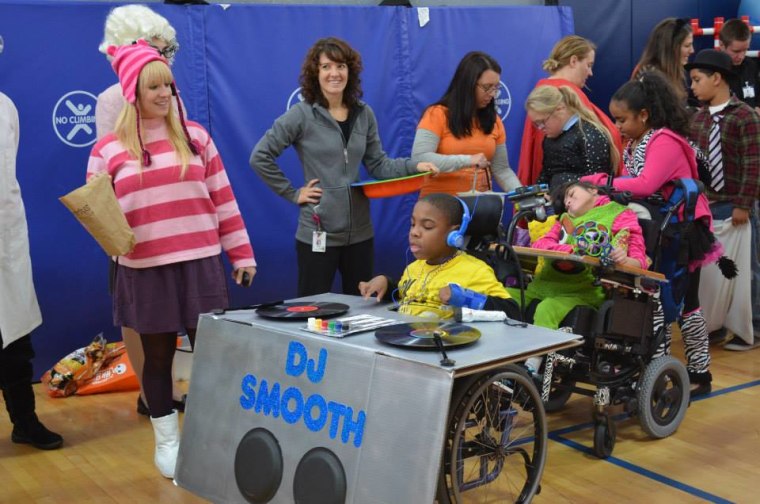 Demetrius Murphy, 13, spins records for his friends at The Grace School at Meeting Street.