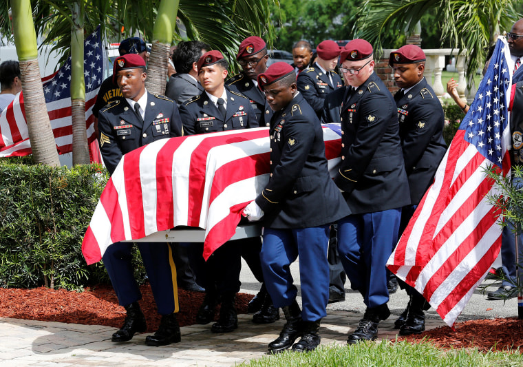 Image: An honor guard carries the coffin of U.S. Army Sergeant La David Johnson, who was among four special forces soldiers killed in Niger, at a graveside service in Hollywood