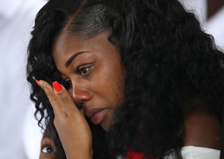 Image: Myeshia Johnson wipes away tears during the burial service for her husband