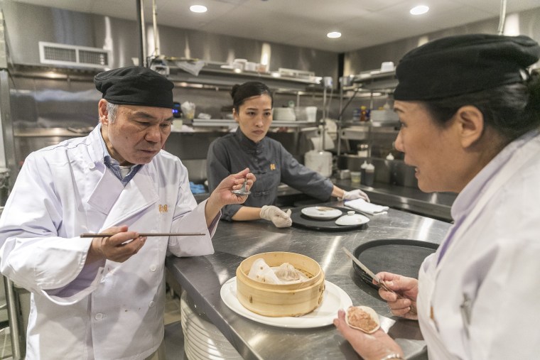 Image: Chen Lieh Tang tastes a xiao long bao at Hwa Yuan