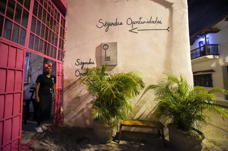 Image: Inmate Arleth Martinez stands in the doorway of the Interno restaurant