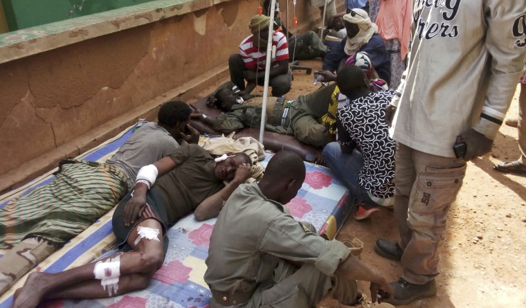 Wounded Malian troops receive medical treatment after a suicide bombing at a base in Gao, Mali, on Jan. 18, 2017.